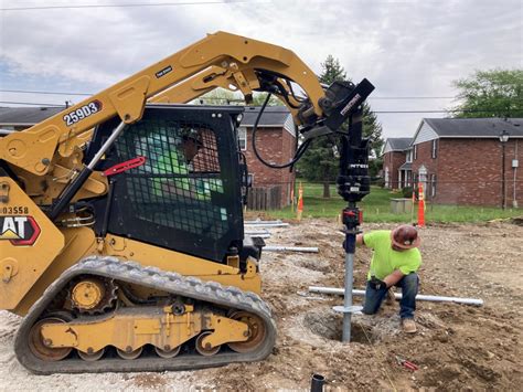 helical pile attachment for skid steer|helical skid steer installation.